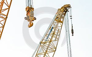 Crawler crane isolated on white background. Real estate industry. Yellow crawler crane use reel lift up equipment in construction