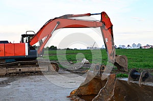 Crawler excavator in construction site on blue sky background. Special heavy construction equipment