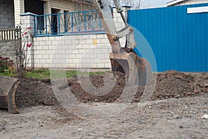 Crawler excavator digging on demolition site. Excavating machine. Earth moving equipment. Excavation vehicle
