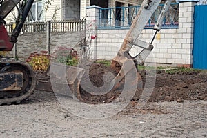 Crawler excavator digging on demolition site. Excavating machine. Earth moving equipment. Excavation vehicle