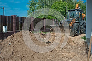 Crawler excavator digging on demolition site. Excavating machine. Earth moving equipment. Excavation vehicle.