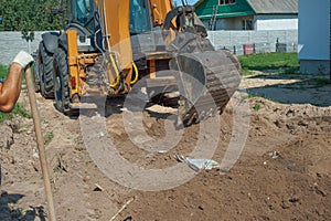 Crawler excavator digging on demolition site. Excavating machine. Earth moving equipment. Excavation vehicle.