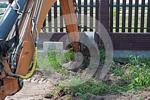 Crawler excavator digging on demolition site. Excavating machine. Earth moving equipment. Excavation vehicle.