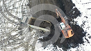 Crawler excavator digging ground for overhaul road
