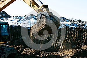 Crawler excavator. Earth-moving machine at a construction site.