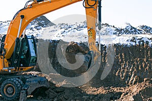 Crawler excavator. Earth-moving machine at a construction site.