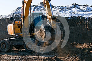 Crawler excavator. Earth-moving machine at a construction site.