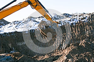 Crawler excavator. Earth-moving machine at a construction site.