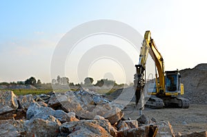 Crawler excavator with hydraulic breaker hammer for the destruction of concrete