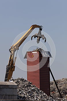 Crawler excavator loading a container