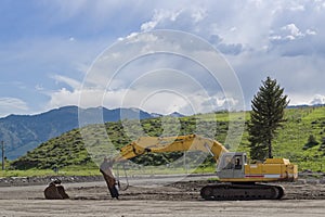 Crawler excavator performs work in a construction site