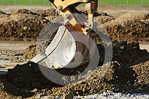 Crawler excavator working on a highway construction site