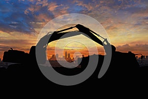 Crawler excavators silhouette are digging the soil