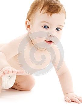 Crawling baby boy in diaper