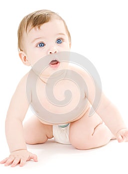Crawling baby boy in diaper