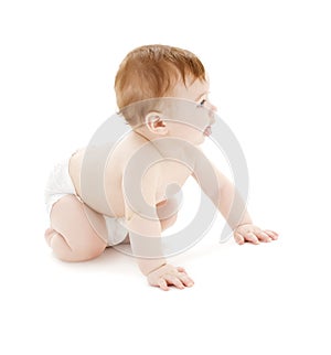 Crawling baby boy in diaper