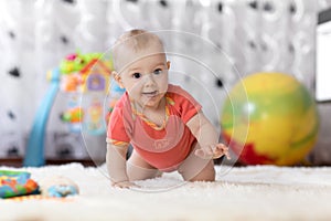 Crawling baby boy at home on floor