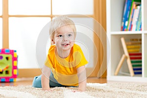 Crawling baby boy indoors photo