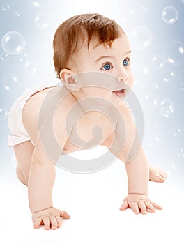 Crawling baby boy looking up