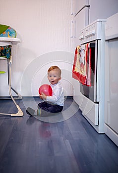 Crawling baby boy playing at home