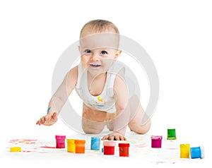 Crawling baby with a finger's paints
