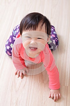 Crawling baby girl smile