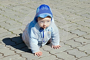 Crawling baby on paving stone