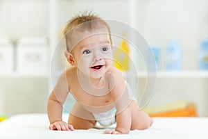 Crawling funny baby boy at home