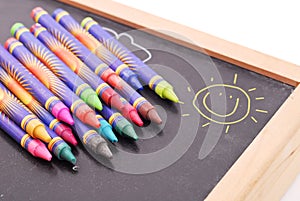 Crayons On Chalkboard