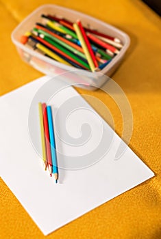 Crayons and paper on the desk