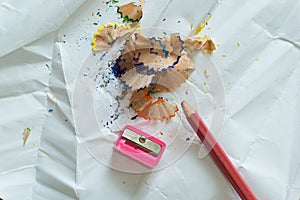 Crayons and sharpener on white background