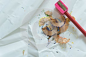 Crayons and sharpener on white background