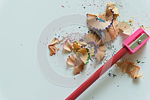 Crayons and sharpener on white background