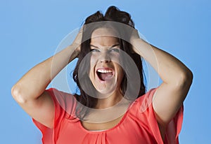 Crazed and Frustrated Woman pulling her hair photo