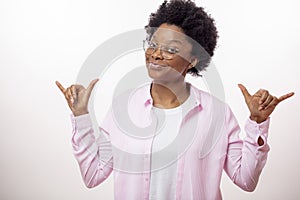 Crazy african woman with horns hands sign.