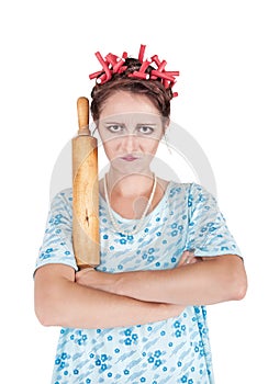 Crazy angry housewife with rolling pin