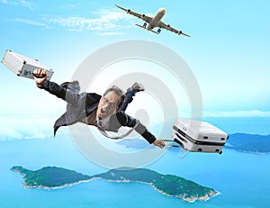 Crazy business man flying from passenger plane with briefcase an