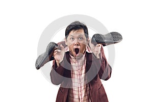 Crazy businessman holding shoes and scream in panic attack emotion isolate on white background