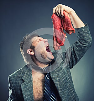 Crazy businessman with meat