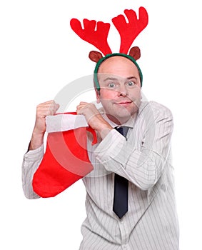 Crazy businessman with rudolph reindeer attire.