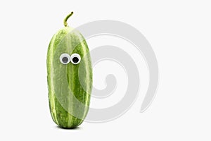 Crazy Carosello cucumber with googly eyes on white background, a
