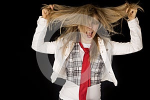 Crazy caucasian young female excited pulling her hair