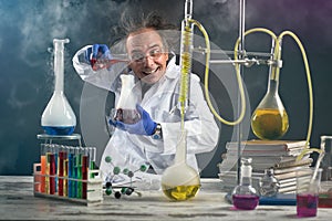 Crazy chemist doing experiment photo