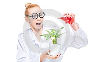 A crazy chemist watering a flower with a chemical substance