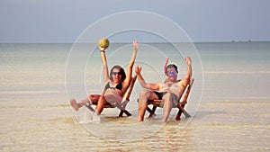 Crazy couple sunbathing inside fantastic crystal water