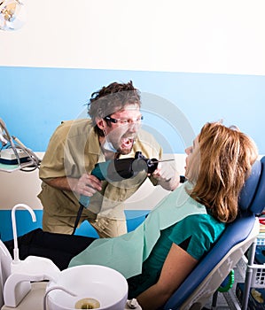 Crazy dentist patient at the dentist, the patient is terrified