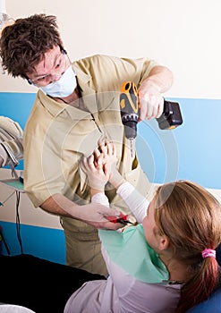 Crazy dentist treats teeth of the unfortunate patient. The patient is terrified.