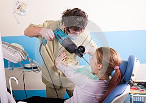 Crazy dentist treats teeth of the unfortunate patient. The patient is terrified.