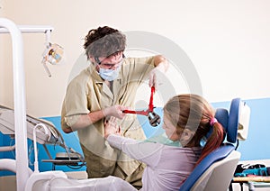 Crazy dentist treats teeth of the unfortunate patient. The patient is terrified.