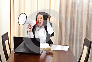 Crazy desperate woman shouting megaphone